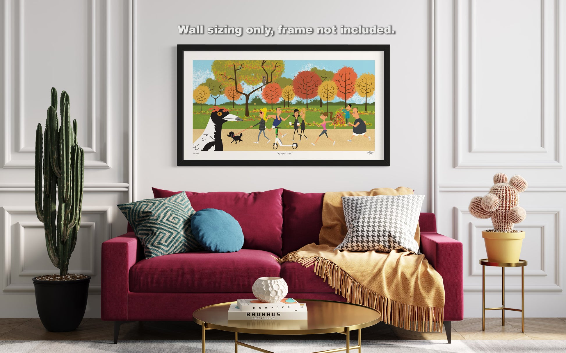 Living room with a red sofa, colorful pillows, and a framed picture of children playing outdoors.