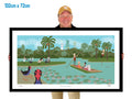 Person holding a framed artwork of a park scene with people and ducks.