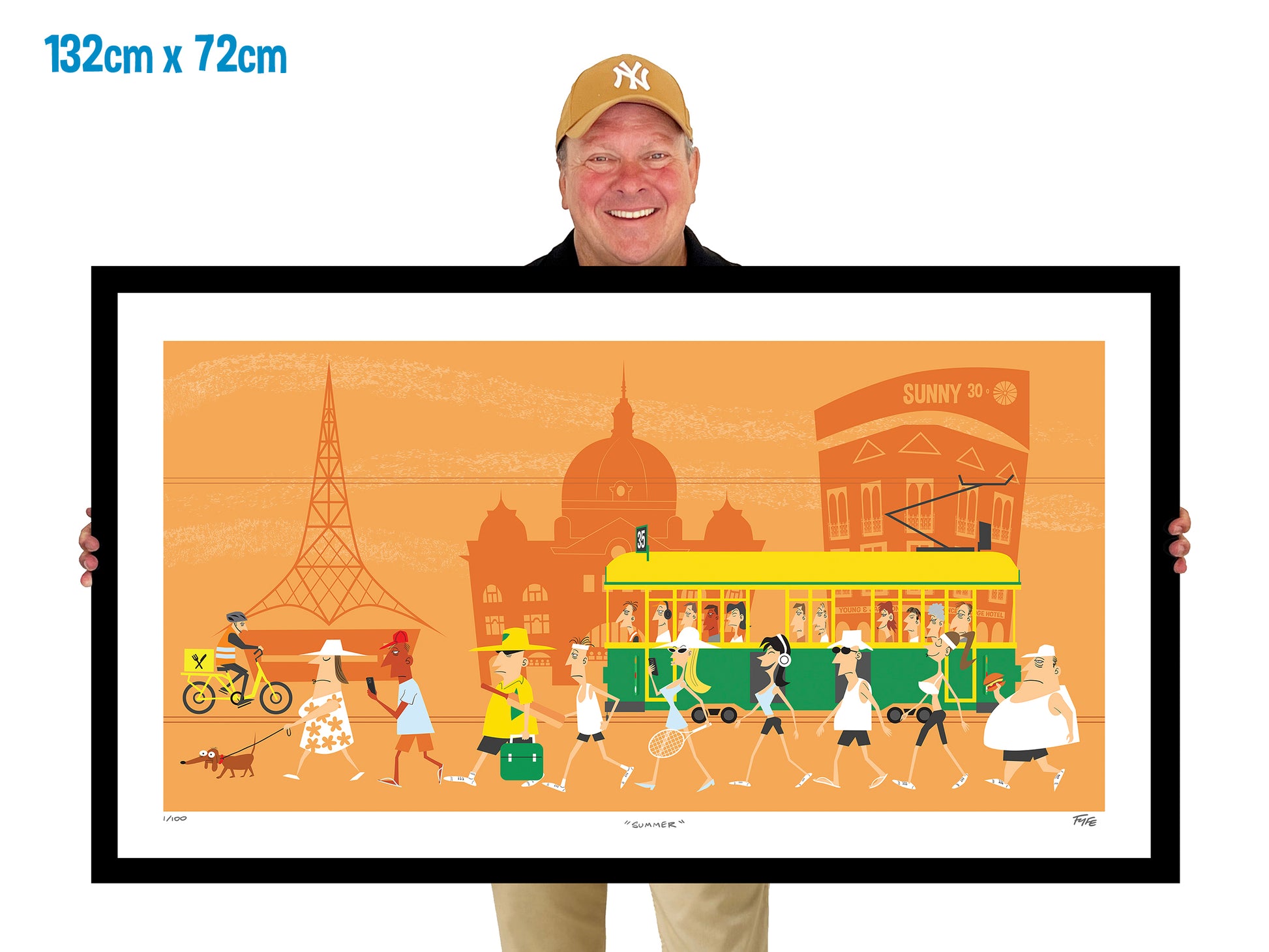 Man holding a large framed artwork of a city scene with people and a tram.