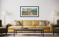 Living room with a yellow sofa, coffee table, and framed artwork on the wall.