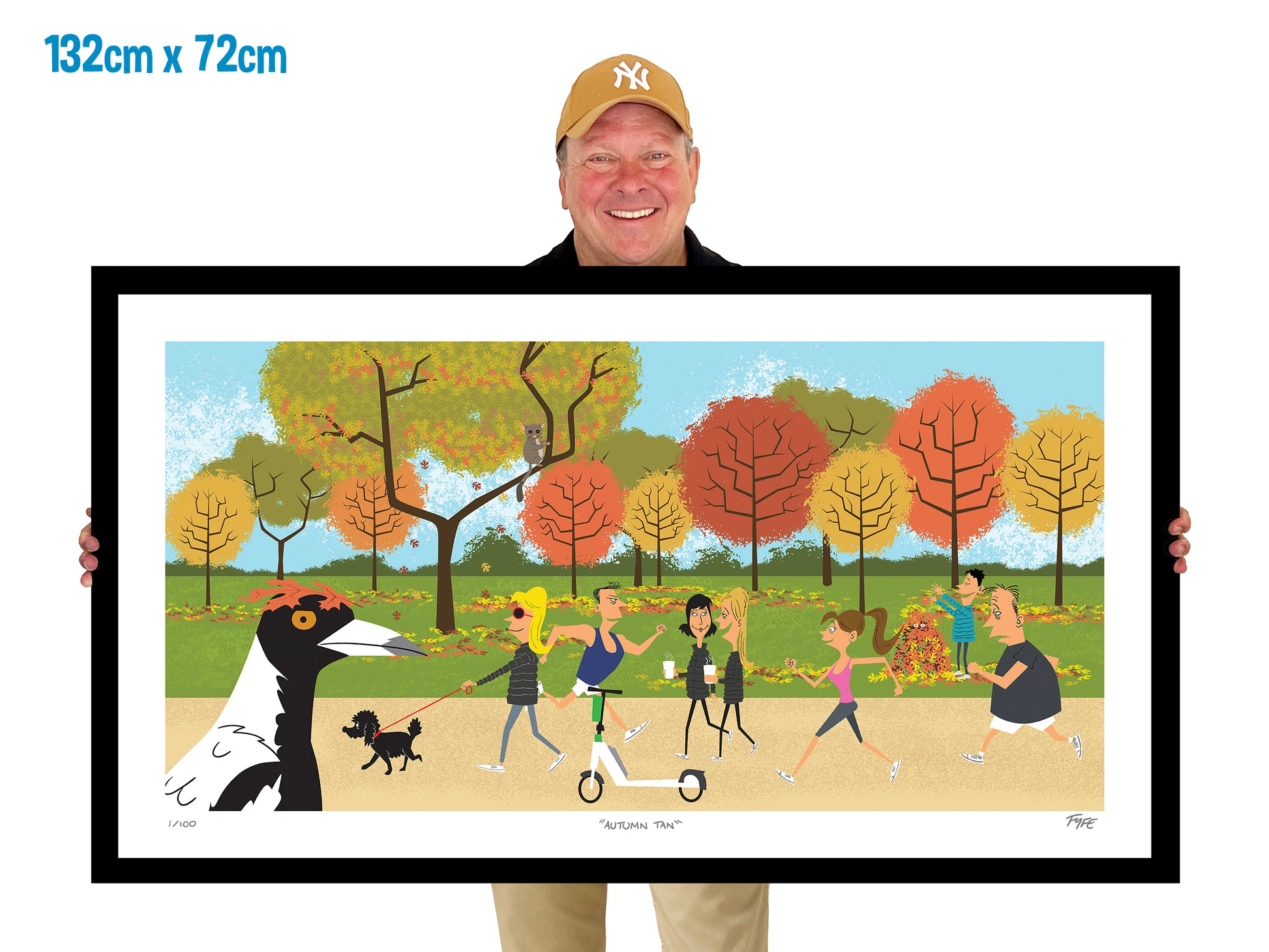 Person holding a large framed artwork of a park scene with people and a dog.