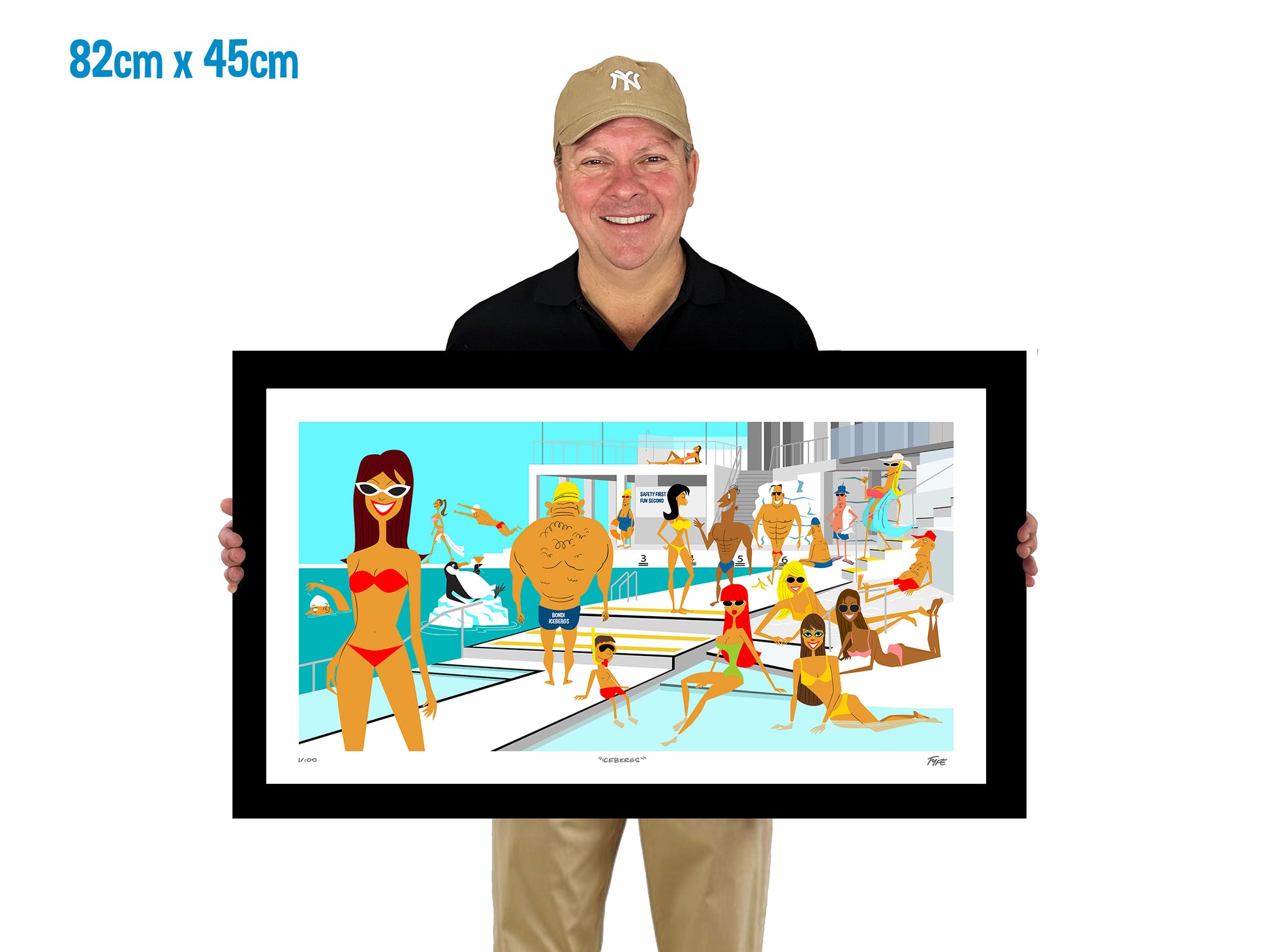 Man holding a framed artwork of people by a pool