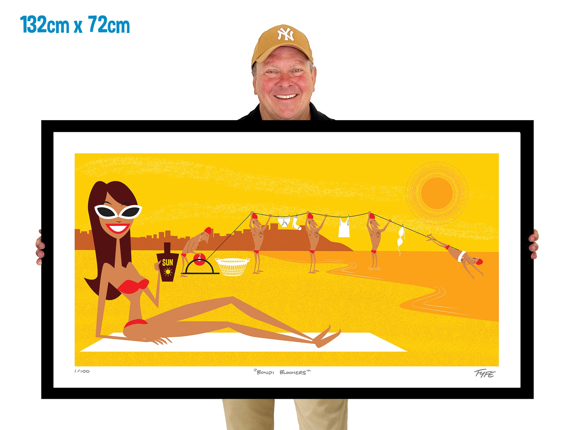 Man holding a framed artwork of a woman sunbaking on Bondi Beach with lifesavers hanging washing in background