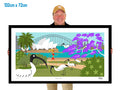 Man holding a large framed artwork of the Sydney Harbour Bridge with birds and a bridge.