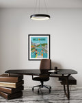 Framed poster of Melbourne on a wall above a desk with books and a chair.