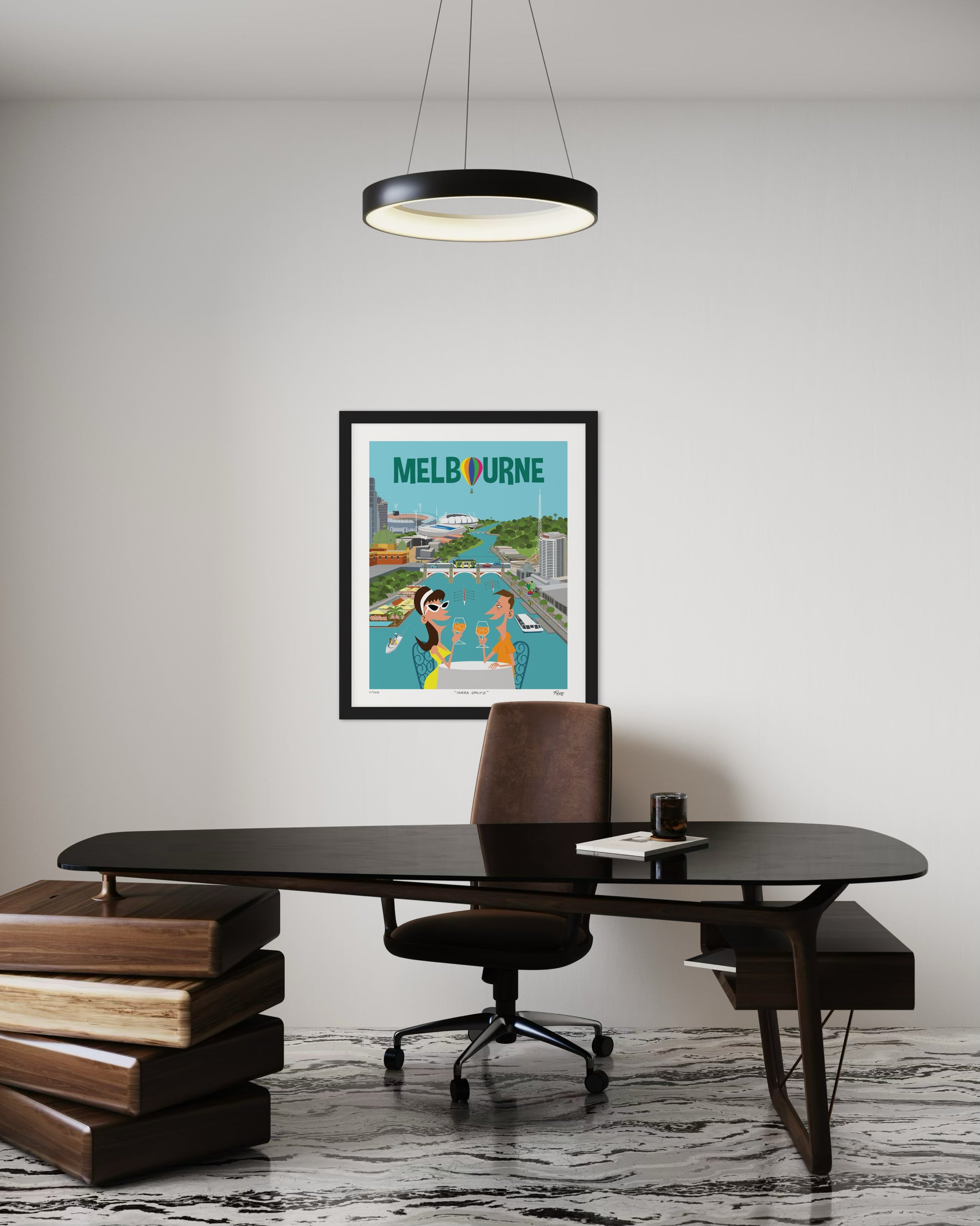 Framed poster of Melbourne on a wall above a desk with books and a chair.